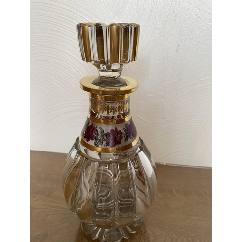 125 - Antique crystal decanter with gilded decoration and roses in stunning condition