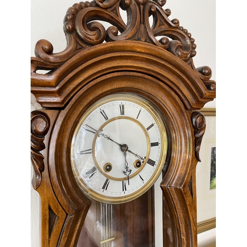 143 - 8 day spring driven wall clock circa 1885 with white porcellane dial with roman numerals, strikes th... 