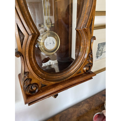 143 - 8 day spring driven wall clock circa 1885 with white porcellane dial with roman numerals, strikes th... 