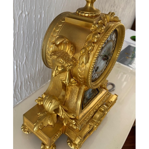 158 - A french ormolu mantel clock surmounted by a paris porcelain urn with acorn finial and acanthus leaf... 