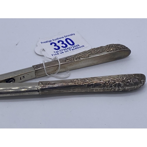 330 - silver handled glove stretchers