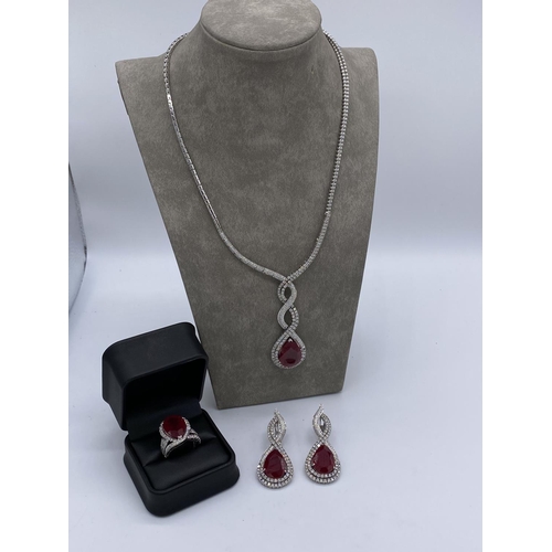 399 - Stunning diamond and ruby necklace, earings and ring set valued at ninety thousand pounds. The full ... 