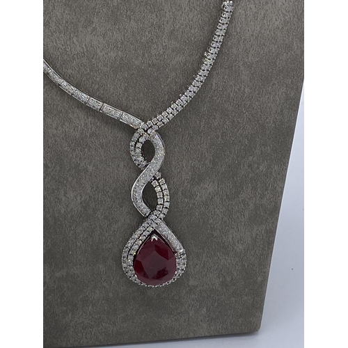 399 - Stunning diamond and ruby necklace, earings and ring set valued at ninety thousand pounds. The full ... 