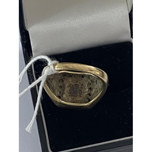 5 - 9ct gold and diamond ring with asian lettering design size S and a half and weighs 6.3g