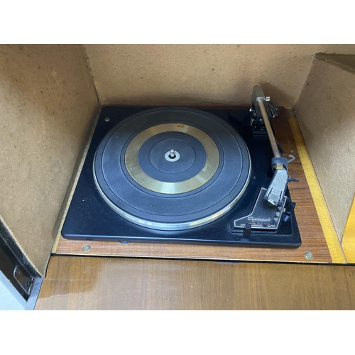 69 - Mid century radiogram with record storage, drop down front, garrard deck. Measures approx 39