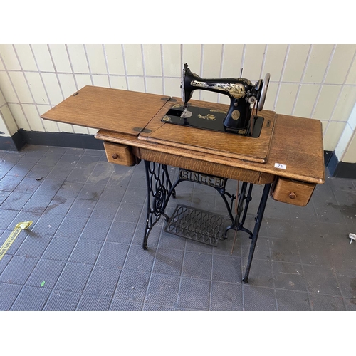 75 - singer treddle sewing machine in good condition and not seized. Needs a new rubber belt which are av... 