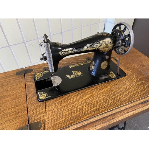 75 - singer treddle sewing machine in good condition and not seized. Needs a new rubber belt which are av... 