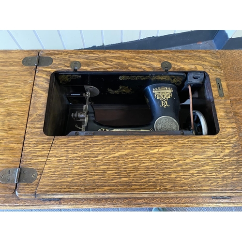 75 - singer treddle sewing machine in good condition and not seized. Needs a new rubber belt which are av... 