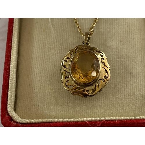 99 - 14ct necklace and pendant with yellow stone measures 19