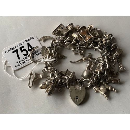 754 - vintage heavy sterling silver charm bracelet with some stunning charms 118g