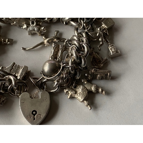 754 - vintage heavy sterling silver charm bracelet with some stunning charms 118g