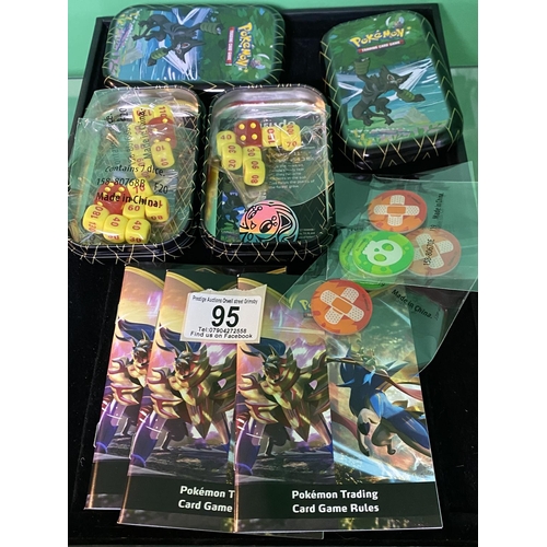 95 - POKEMON 2 TINS OF DICE, COINS ETC