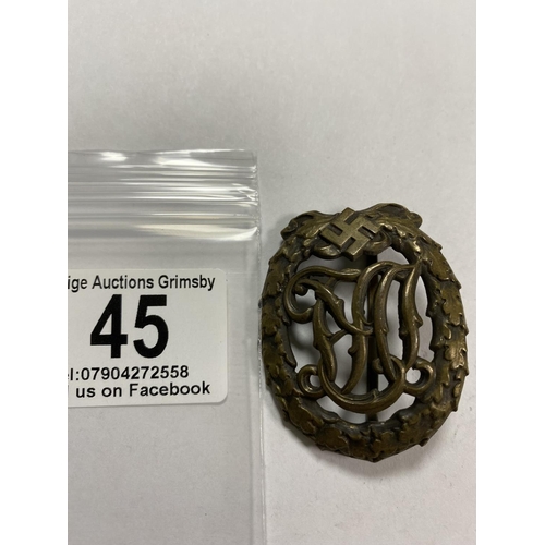 45 - WW2 GERMAN DRL SPORTS BADGE WITH WERNSTEIN JENA & DRGM 35269 ON THE BACK