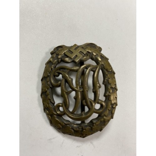 45 - WW2 GERMAN DRL SPORTS BADGE WITH WERNSTEIN JENA & DRGM 35269 ON THE BACK