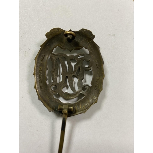 45 - WW2 GERMAN DRL SPORTS BADGE WITH WERNSTEIN JENA & DRGM 35269 ON THE BACK