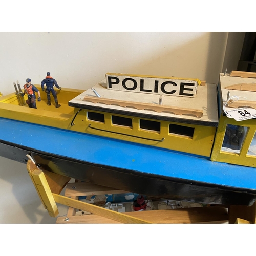 84 - MOTORIZED WOODEN CONSTRUCTION POLICE BOAT LENGTH 83CM WIDTH 30CM