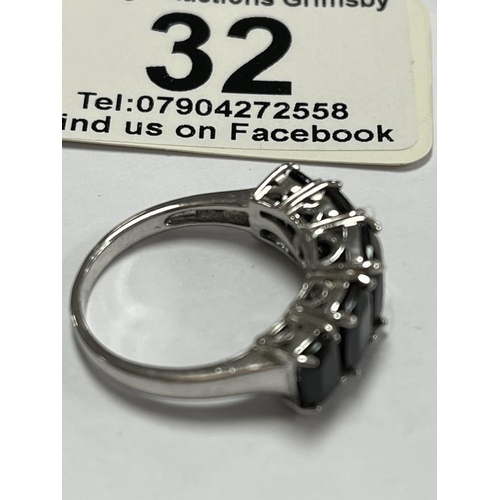 32 - STERLING SILVER TV CHANNEL DARK STONE RING SIZE O