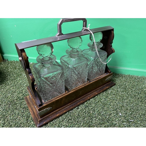 340 - ANTIQUE TANTALUS WITH SILVER PLATED LOCKING TOP, COMPLETE WITH 3 DECANTERS BEING CRYSTAL, SOME AGE-R... 