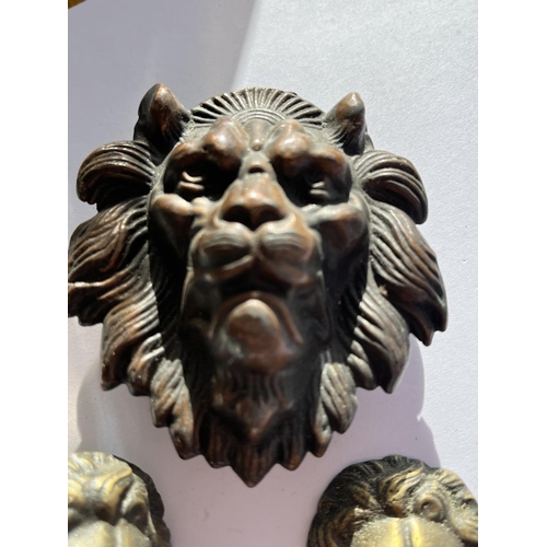 64 - 3 VINTAGE LION HEAD BADGES