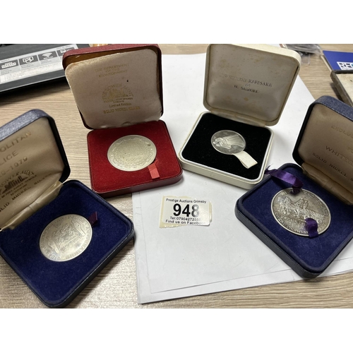 948 - 4 MEDALLIONS IN A CASE