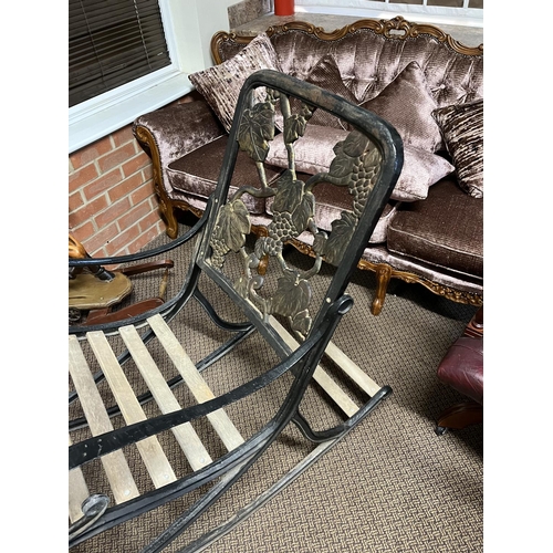 168 - CAST IRON GARDEN ROCKING CHAIR APPROX 53” LENGTH AT BASE 23” WIDE 41” TALL AND VERY HEAVY