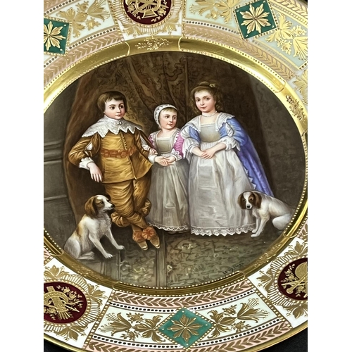 40 - A VERY FINE ROSENTHAL PLATE DECORATED IN THE VIENNA STYLE WITH THE CENTRE SHOWING THREE CHILDREN & T... 