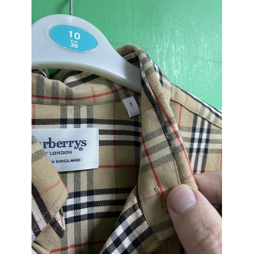 59 - BURBERRY SHIRTS X2 RED SHIRT IS A LARGE THE CHECK SHIRT IS A MEDIUM ALSO A BURBERRY TRENCH COAT WHIC... 