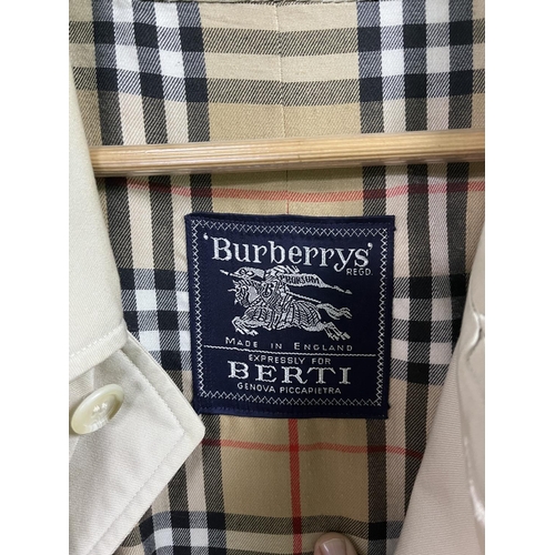 59 - BURBERRY SHIRTS X2 RED SHIRT IS A LARGE THE CHECK SHIRT IS A MEDIUM ALSO A BURBERRY TRENCH COAT WHIC... 