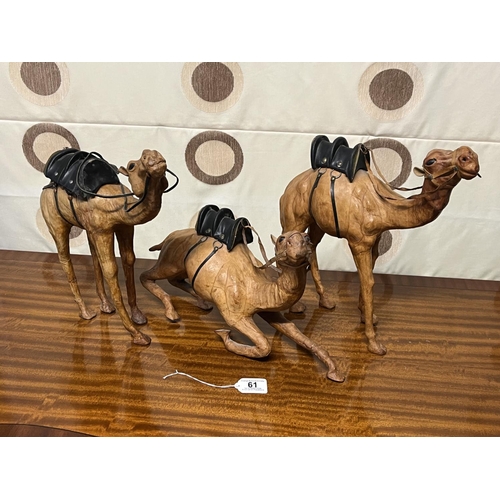 61 - 3 VINTAGE LEATHER COVERED CAMELS THE LARGES IS 40CM WIDE AND ONE OF THE CAMELS IS A/F