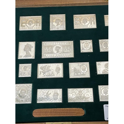 66 - STERLING SILVER STAMP SET IN AN INLAID WOODEN BOX 485. GRAMS THE STAMPS ARE OF ROYALTY