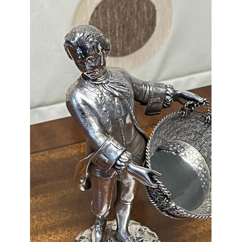 70 - STERLING SILVER MAN WITH BASKET POSSIBLY FOR SALT 437 GRAMS 17.5CM TALL