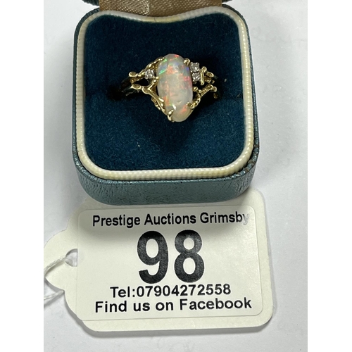 98 - 18CT GOLD OPAL RING WITH 3 SMALL DIAMONDS LOTS OF FIRE AND UNUSUAL DESIGN WEIGHS TOTAL WEIGHT OF 5.7... 