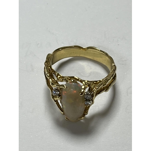 98 - 18CT GOLD OPAL RING WITH 3 SMALL DIAMONDS LOTS OF FIRE AND UNUSUAL DESIGN WEIGHS TOTAL WEIGHT OF 5.7... 