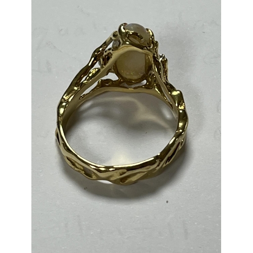 98 - 18CT GOLD OPAL RING WITH 3 SMALL DIAMONDS LOTS OF FIRE AND UNUSUAL DESIGN WEIGHS TOTAL WEIGHT OF 5.7... 