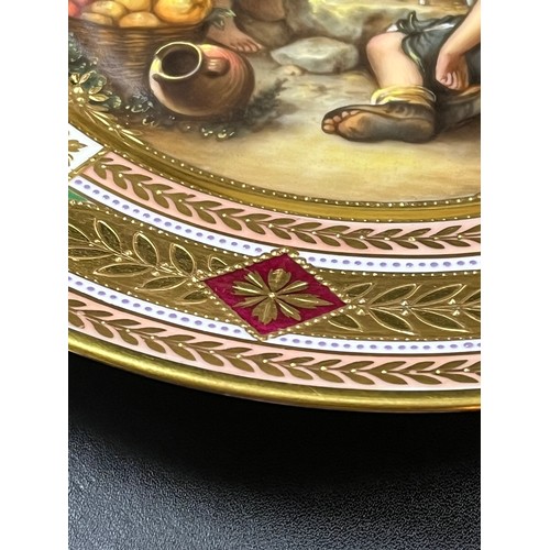 39 - A WELL PAINTED ROSENTHAL PLATE WITH A SCENE OF CHILDREN PLAYING DICE, AFTER A PAINTING BY MURILLO, T... 