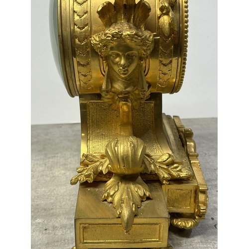 126 - A FRENCH ORMOLU CLOCK SURMOUNTED BY A PARIS PORCELAIN URN WITH ACORN FINIAL AND ACANTHUS LEAF SCROLL... 