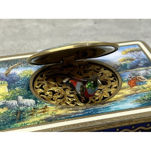 129 - A GERMAN ENAMELED & GILT METAL SINGING BIRD AUTOMATON WORKS ATTRIBUTED TO KARL GRIESBAUM STUNNING CO... 