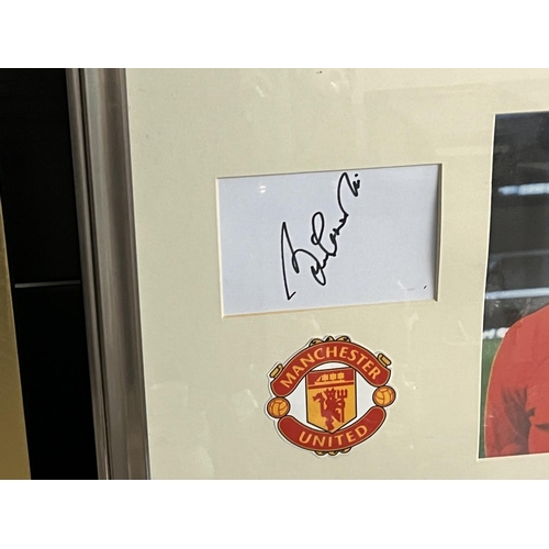 4 - SIGNED BOBBY CHARLTON PICTURE FRAMED WITH A C.O.A MEASURES 46CM WIDE 36CM TALL