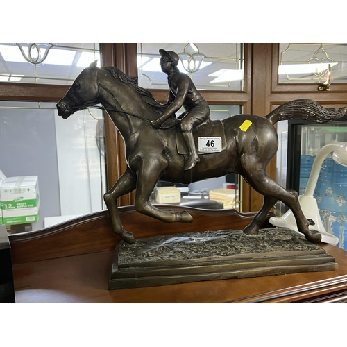 46 - BRONZE RACING HORSE WITH RIDER ON A STAND MEASURES APPROX HEAD TO TAIL 52CM BASE TO THE TOP OF THE R... 