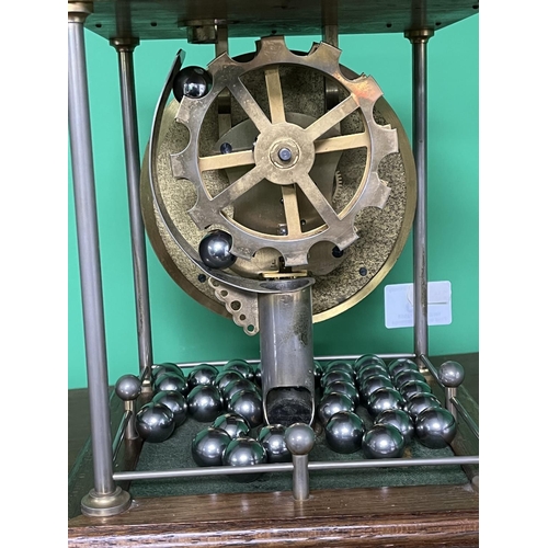 98 - BALL BEARING SKELETON CLOCK THWAITES & REED MADE FROM BRASS SIZE APPROX 21CM WIDE AT THE BASE 26CM T... 