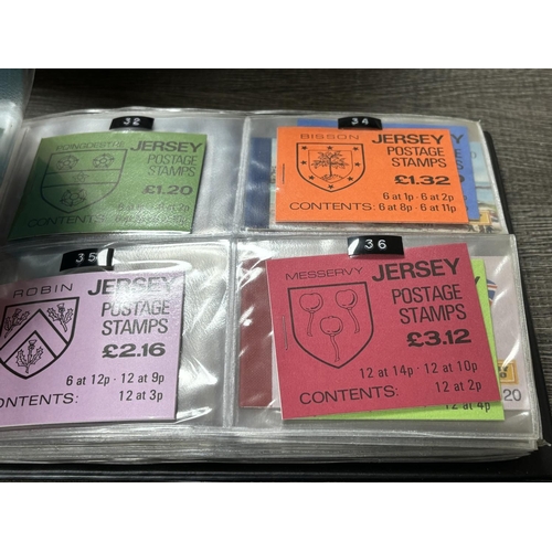 25 - FOLDER OF JERSEY & GUERNSEY STAMP BOOKLETS APPROXIMATELY 89