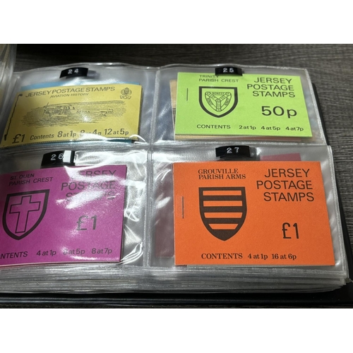 25 - FOLDER OF JERSEY & GUERNSEY STAMP BOOKLETS APPROXIMATELY 89