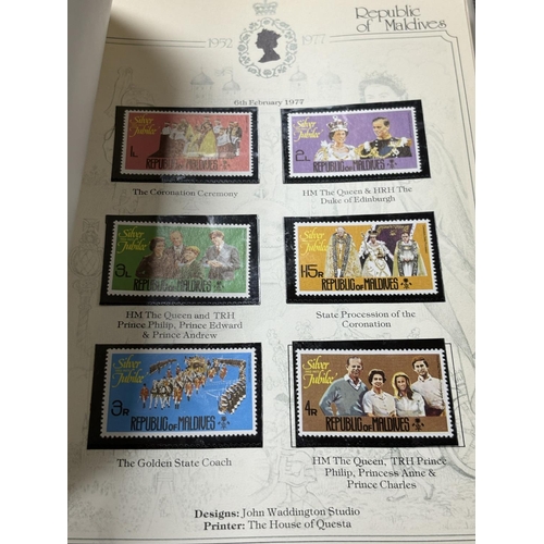 67 - SILVER JUBILEE COMMEMORATIVEVALBUM OF MINT CONDITION STAMPS AND STAMP BOOKS OF THE COMMONWEALTH