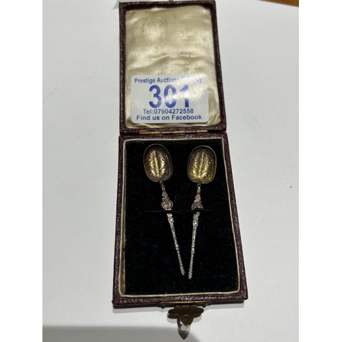 301 - SILVER ANNOINTING SPOONS IN AN OLD CASE