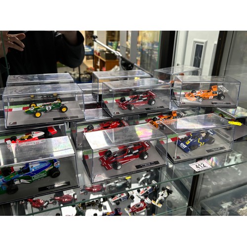 412 - SHELF OF 10 BOXED RACING CARS FORMULA 1 PLEASE SEE PICTURES FOR CONTENT