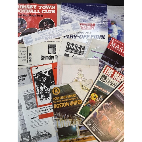 45 - PILE OF GRIMSBY TOWN RELATED FOOTBALL PROGRAMMES SPANNING SEVERAL DECADES