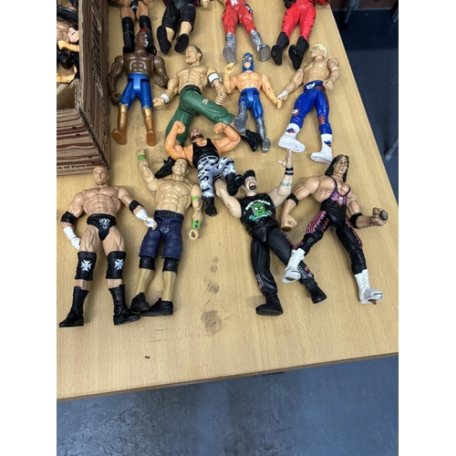 173 - BOX OF WRESTLING FIGURES INCLUDES BRETT THE HITMAN HEART, CANE, THE ROCK PLEASE SEE PICTURES FOR DET... 