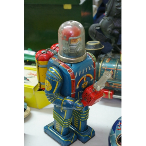 15 - Japanese battery operated tin plate robot with ray gun - height 10.75 ins.