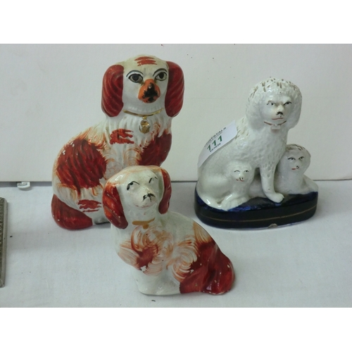 111 - Three Staffordshire pottery King Charles spaniels