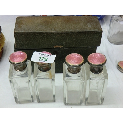 122 - Cased set of four toilet bottles with silver and enamel tops, London 1903